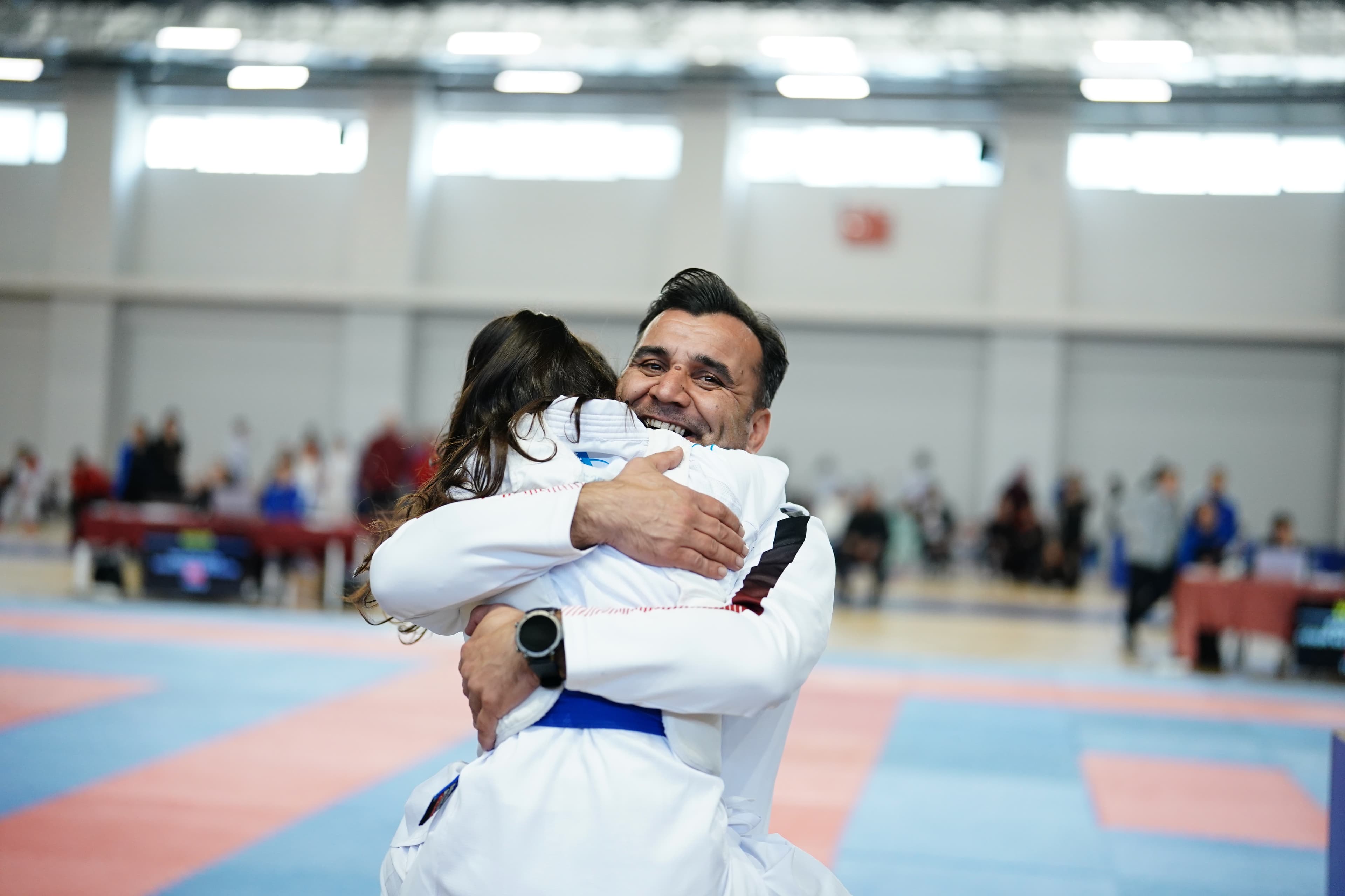 Coach embracing an athlete after a match, Dardanelles Cup 2025