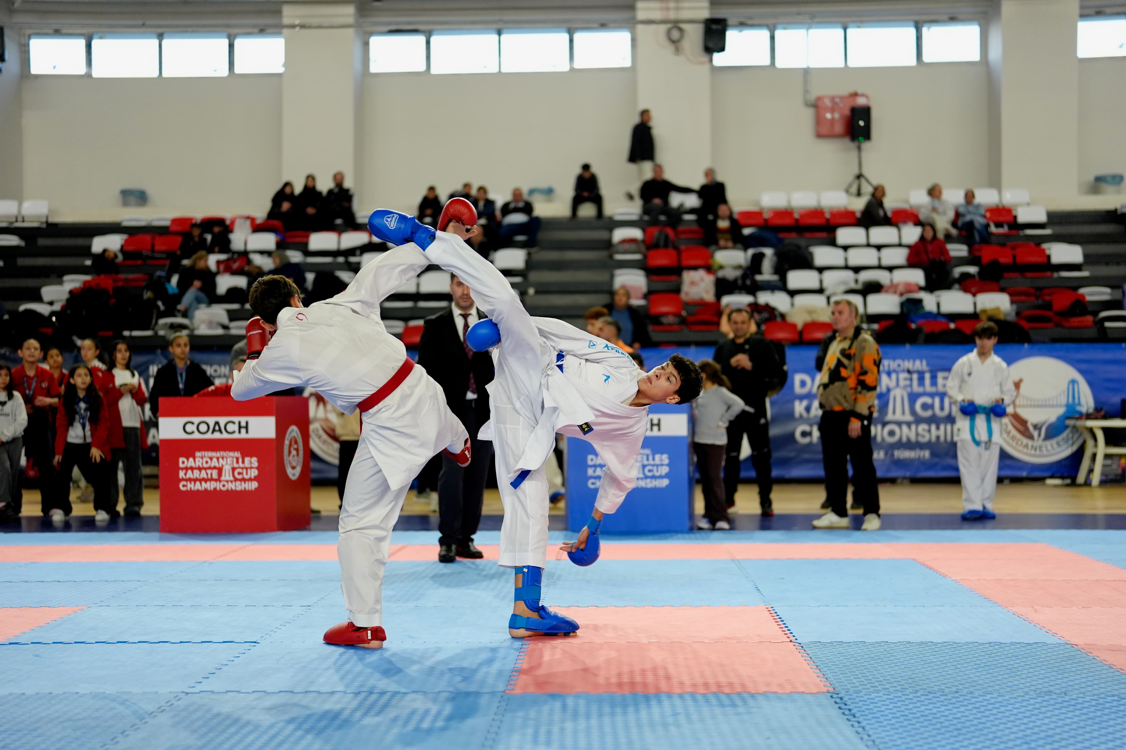 Spinning kick exchange in a kumite match, Dardanelles Cup 2025